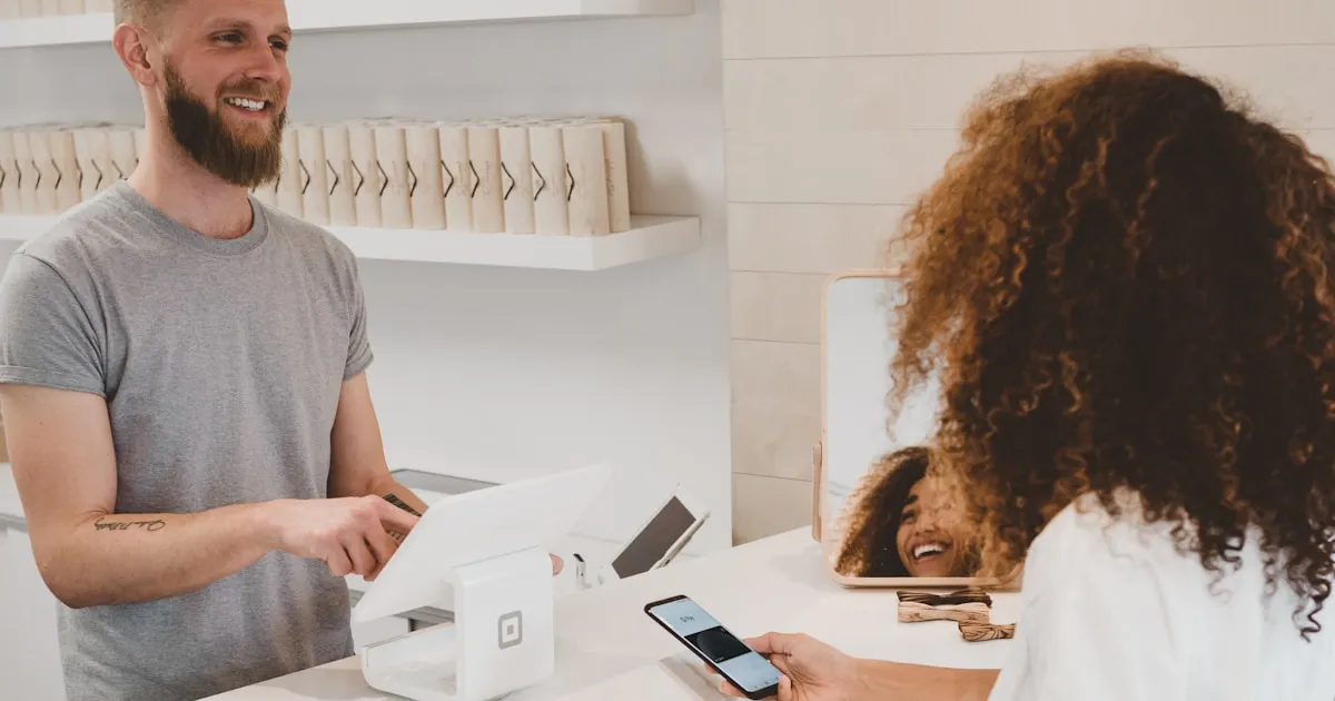 Retail counter with a laptop chat widget and a store phone